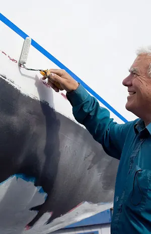 Painting a boat hull with a roller
