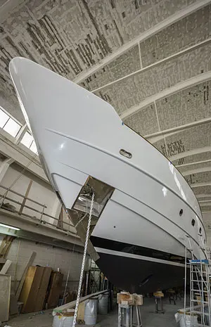 Hull hauled and stored inside a boat shed
